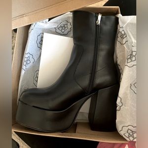 Black platform heeled boots